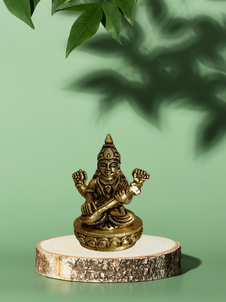 Goddess Saraswati Sitting on Lotus – Brass Pooja Idol